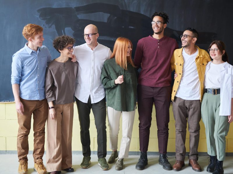 Canva-Group-of-People-Standing-Beside-Chalk-Board--scaled